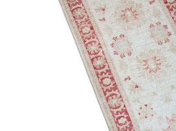 Backside of handmade New Farahan rug showing knot structure and weave density