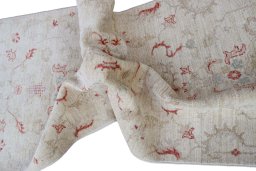 Backside of handmade New Farahan rug showing knot structure and weave density