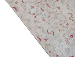 Backside of handmade New Farahan rug showing knot structure and weave density