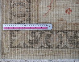 Backside of handmade New Farahan rug showing knot structure and weave density