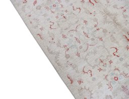 Backside of handmade New Farahan rug showing knot structure and weave density