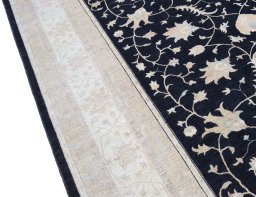 Backside of handmade New Farahan rug showing knot structure and weave density