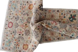Backside of handmade New Farahan rug showing knot structure and weave density
