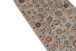 Backside of handmade New Farahan rug showing knot structure and weave density