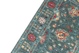 Backside of handmade New Farahan rug showing knot structure and weave density