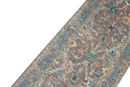 Backside of handmade New Farahan rug showing knot structure and weave density
