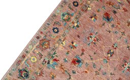 Backside of handmade New Farahan rug showing knot structure and weave density