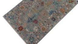 Backside of handmade New Farahan rug showing knot structure and weave density