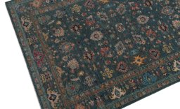 Backside of handmade New Farahan rug showing knot structure and weave density