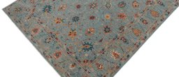 Backside of handmade New Farahan rug showing knot structure and weave density