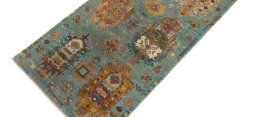 Backside of handmade New Farahan rug showing knot structure and weave density
