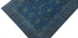 Backside of handmade New Farahan rug showing knot structure and weave density