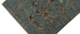 Backside of handmade New Farahan rug showing knot structure and weave density