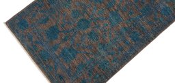 Backside of handmade New Farahan rug showing knot structure and weave density