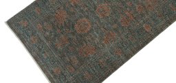 Backside of handmade New Farahan rug showing knot structure and weave density