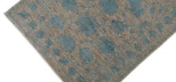 Backside of handmade New Farahan rug showing knot structure and weave density