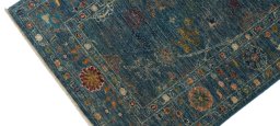 Backside of handmade New Farahan rug showing knot structure and weave density