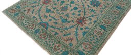 Backside of handmade New Farahan rug showing knot structure and weave density