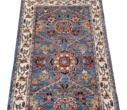 Backside of handmade New Farahan rug showing knot structure and weave density