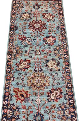 Backside of handmade New Farahan rug showing knot structure and weave density