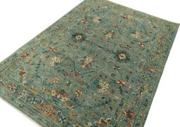 Backside of handmade New Farahan rug showing knot structure and weave density