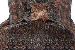 Surface texture of 1930s Farahan rug with natural Wool and intricate pattern