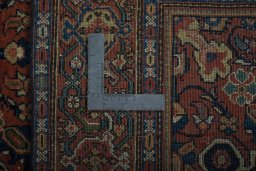 Backside of handmade 1930s Farahan rug showing knot structure and weave density