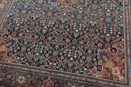 Close-up detail of 1930s Farahan rug from Iran / Persia showing Wool weave