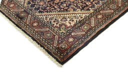 Surface texture of 2000s Farahan rug with natural Wool and intricate pattern