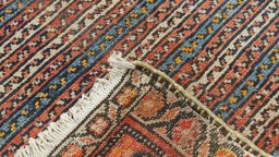 Corner detail of 1920s Farahan rug showing border pattern and Wool pile