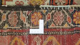 Close-up detail of 1920s Farahan rug from Iran / Persia showing Wool weave