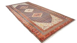 Close-up detail of 1920s Farahan rug from Iran / Persia showing Wool weave