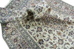 Surface texture of 2000s Kashan rug with natural Wool and intricate pattern