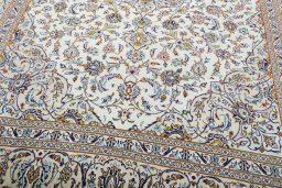 Close-up detail of 2000s Kashan rug from Iran / Persia showing Wool weave