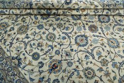 Close-up detail of 2000s Kashan rug from Iran / Persia showing Wool weave