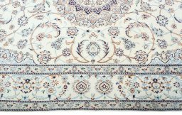 Corner detail of 2000s Nain rug showing border pattern and Wool pile