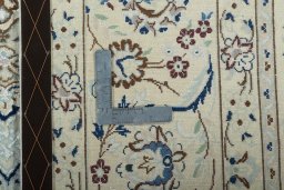Backside of handmade 2000s Nain rug showing knot structure and weave density
