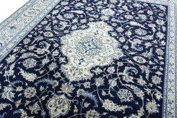 Backside of handmade 2000s Nain rug showing knot structure and weave density