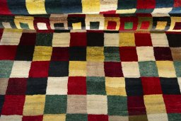 Full view of 2000s Persian Gabbeh rug from Pakistan, 226 × 153 cm in Multi Color tones