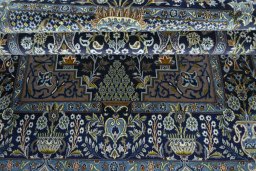Close-up detail of 2000s Kashan rug from Iran / Persia showing Wool weave