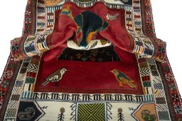 Corner detail of 2000s Persian Gabbeh rug showing border pattern and Wool pile