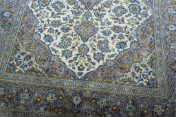 Close-up detail of 2000s Kashan rug from Iran / Persia showing Wool weave