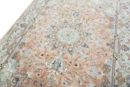 Backside of handmade 2000s Tabriz 50/60/70 Raj rug showing knot structure and weave density