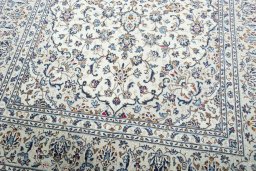 Close-up detail of 2000s Kashan rug from Iran / Persia showing Wool weave