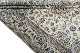 Close-up detail of 2000s Nain rug from Iran / Persia showing Wool weave