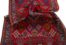 Close-up detail of 2000s Meymeh rug from Iran / Persia showing Wool weave