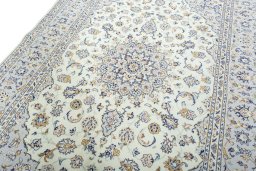 Backside of handmade New Kashan rug showing knot structure and weave density