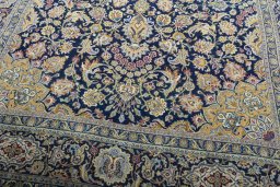 Close-up detail of 2000s Kashan rug from Iran / Persia showing Wool weave