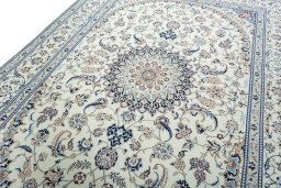 Backside of handmade New Nain rug showing knot structure and weave density