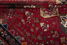 Corner detail of 2000s Shiraz rug showing border pattern and Wool pile